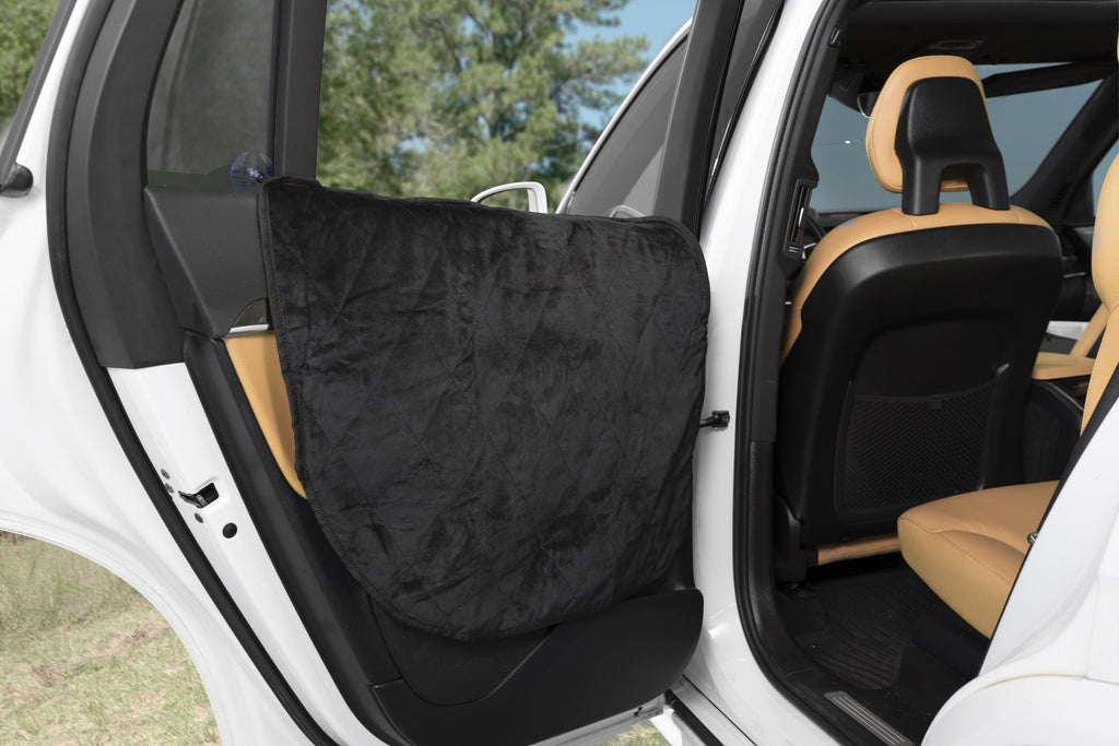 Plush Paws Products: Back door of car with black and tan seat cover.