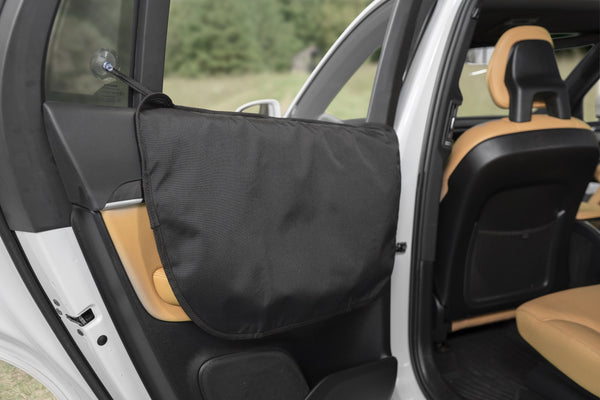 An open car door featuring a black cover, specifically for Premium Car Seat Covers For Dogs.